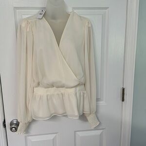 Express ivory peplum blouse. NWT size L.